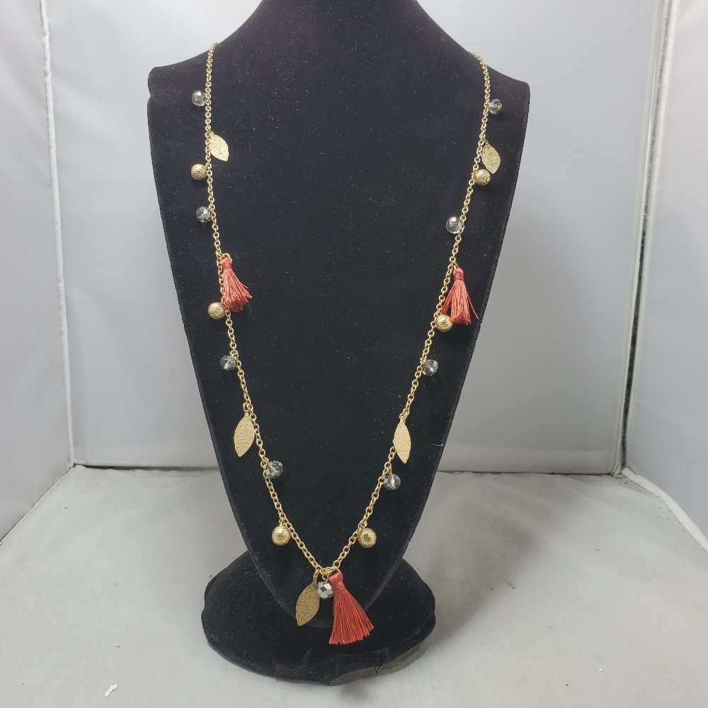 Spring Street orange fringe tassel with gold disco ball and leaf necklace